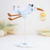 Figura para bautizo Cigüeña con niña de metal - Decoración De Bautizo